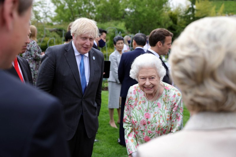 Queen Elizabeth II and British Prime Minister Boris Johnson are seen at a dinner hosted by the Eden Project on June 11 in Cornwall, Britain. File Photo by Andrew Parsons/No. 10 Downing Street/UPI | <a href="/News_Photos/lp/77834d09c412797d893fb6424bdc74d1/" target="_blank">License Photo</a>