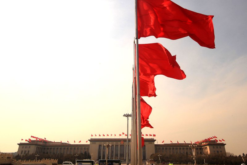 Chinese national flags fly over the Great Hall of the People in Beijing. File Photo by Stephen Shaver/UPI | <a href="/News_Photos/lp/fd2ff253223c6a9276c22b803bb03fc2/" target="_blank">License Photo</a>