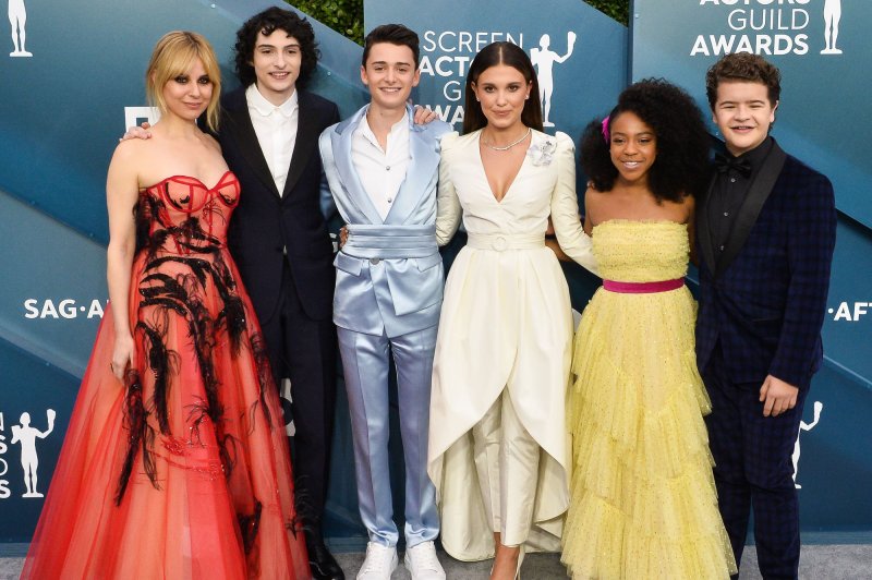 "Stranger Things" cast members, left to right, Cara Buono, Finn Wolfhard, Noah Schnapp, Millie Bobby Brown, Priah Ferguson and Gaten Matarazzo arrive for the 26th annual SAG Awards in 2020. File Photo by Jim Ruymen/UPI