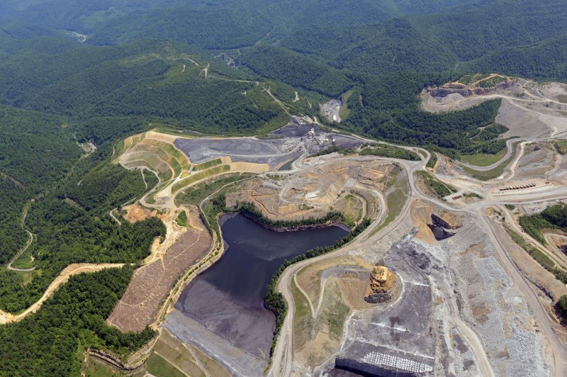 Coal operations often include a pond where toxic sludge, a combination of coal ash and other coal production byproducts, is stored. File photo by UPI/Debbie Hill