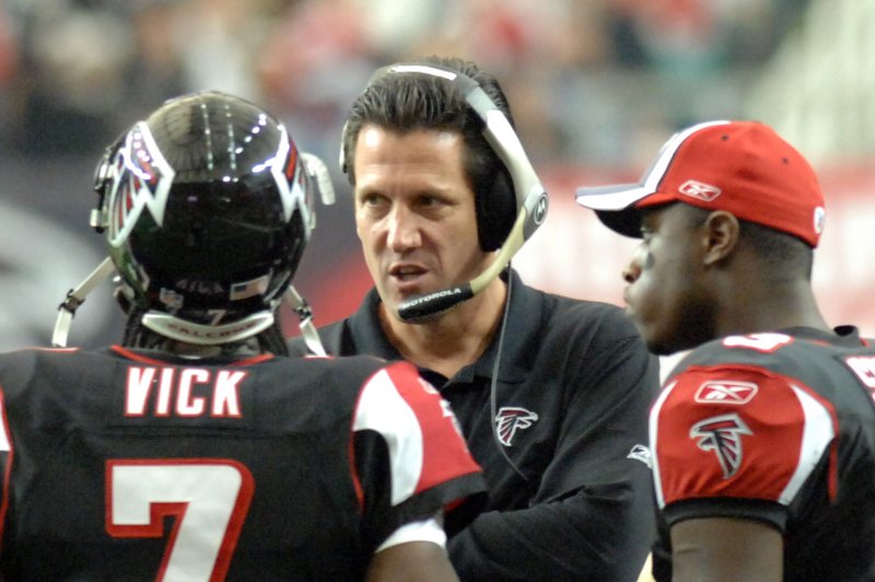 Former Atlanta Falcons assistant coach Greg Knapp (C) worked with many star quarterbacks in his coaching career, including former Falcons scrambler Michael Vick. File Photo by John Dickerson/UPI
