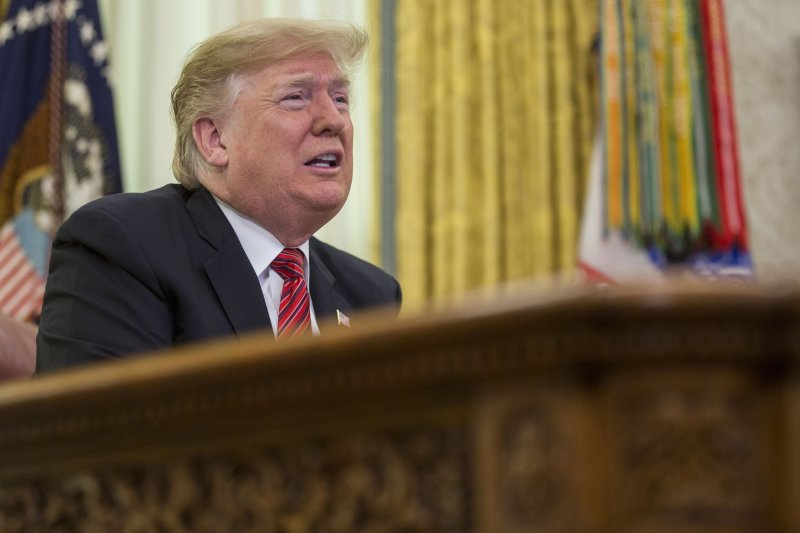 President Donald Trump issued an executive order Friday to freeze civilian federal workers pay in 2019. Photo by Zach Gibson/UPI