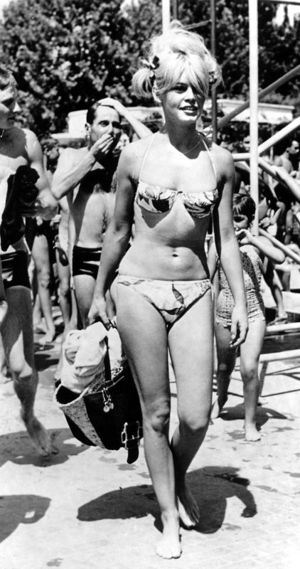 Brigitte Bardot sports a bikini at the beach in the early 1960s. International Bikini Day celebrates the day French designer Louis Reard released the two-piece bikini swimsuit on July 5, 1946. UPI File Photo