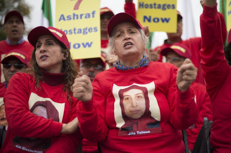 Iranian Maleheh Hosseini (R) participates in a rally at the White House against Iraqi Prime Minister Nuri al-Maliki and his alleged killing of 52 Iranian dissidents at Camp Ashraf in Iraq in 2013. File Photo by Kevin Dietsch/UPI