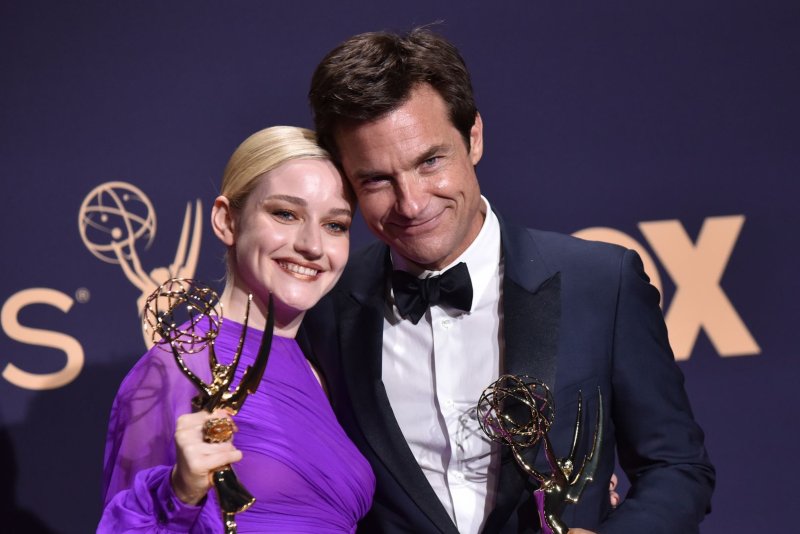 Jason Bateman (R) and Julia Garner of "Ozark" appear backstage during the 71st annual Primetime Emmy Awards in September 2019. File Photo by Christine Chew/UPI.