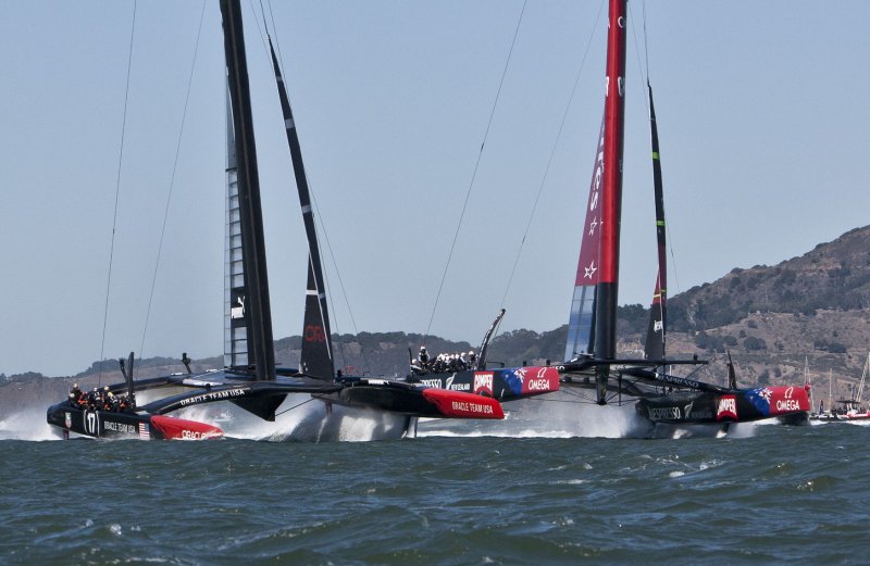 Oracle Team USA (L) and Emirates New Zealand head for the first mark in race 10 of the America's Cup on San Francisco Bay, Sept. 15, 2013. The USA won race 9 and split the day with the Kiwis, who took race 10. UPI/Terry Schmitt