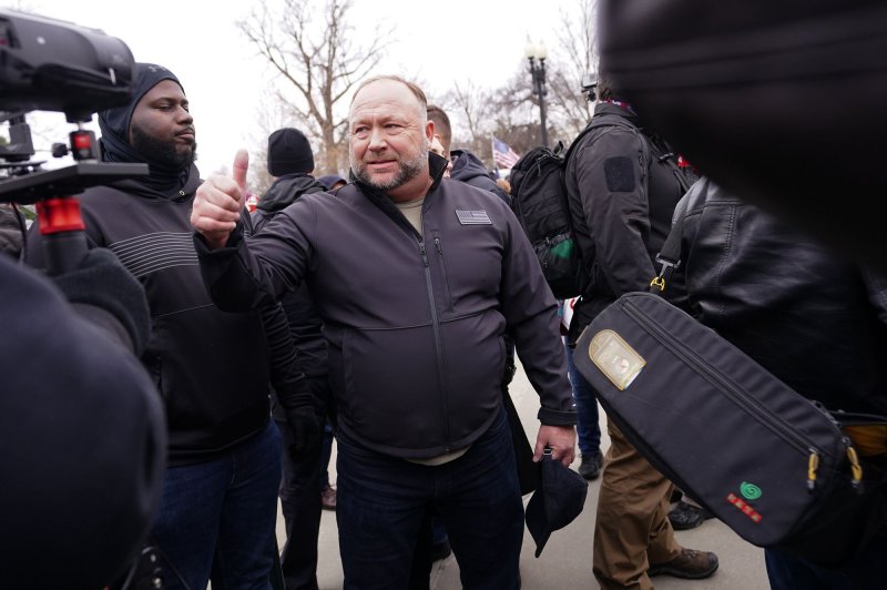 Alex Jones, radio host, greets supporters of President Donald Trump at a rally in Washington, D.C., on January 5, 2021. Three companies connected to Jones have filed for bankruptcy. File Photo by Kevin Dietsch/UPI
