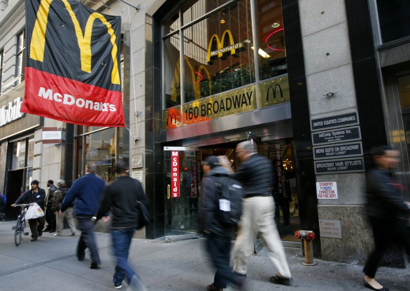 People pass by a McDonald's restaurant on November 8, 2011 in New York City. UPI /Monika Graff.