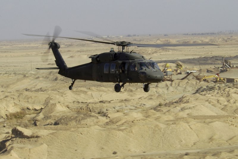 A UH-60L Blackhawk Helicopter flies a low-level mission over Iraq on Jan. 7, 2004. The cause of the March 10 crash that killed 11 servicemen on a training mission in the Gulf of Mexico was "spacial disorientation," military investigators said. Photo by Suzanne M. Jenkins/Air Force | <a href="/News_Photos/lp/2fc919cb32da68748849af161e0d8dea/" target="_blank">License Photo</a>