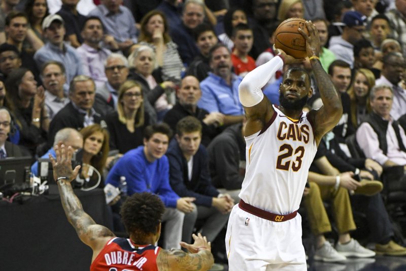 Cleveland Cavaliers forward LeBron James (23) scores against Washington Wizards forward Kelly Oubre Jr. (12) in the first half on November 3, 2017 at Capital One Arena in Washington, D.C. Photo by Mark Goldman/UPI