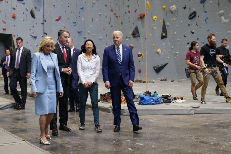 From left to right, first lady Jill Biden, Gov. Ralph Northam, and President Joe Biden visit the Sportrock Climbing Center to recognize the progress Virginia has made in the fight against COVID-19, in Alexandria, Va., on Friday. Photo by Chris Kleponis/UPI | <a href="/News_Photos/lp/f810a66e8245854a83cb33dbffee9d32/" target="_blank">License Photo</a>