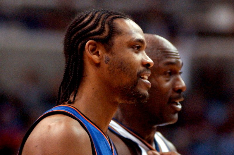 Latrell Sprewell returns to MSG, sits next to New York Knicks owner James Dolan
