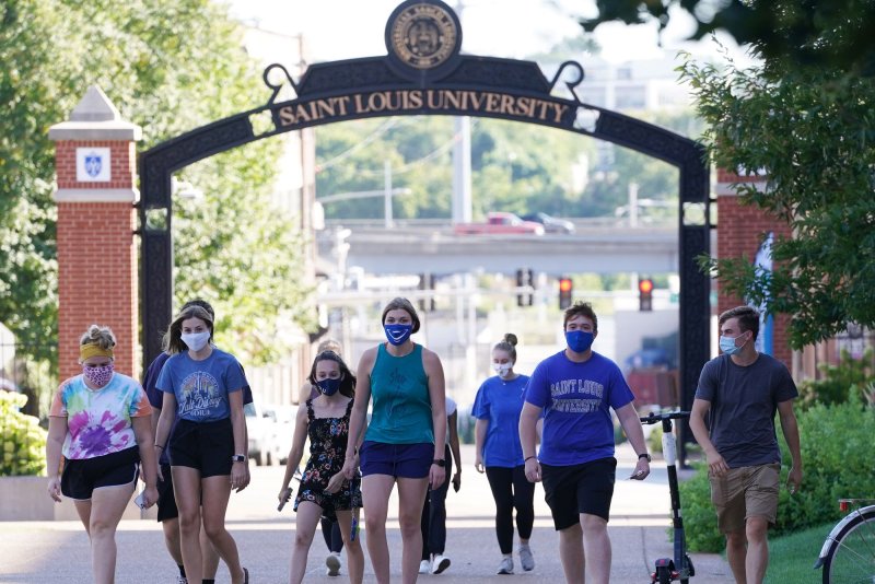 College students wearing masks to protect against COVID-19 walk on the Saint Louis University campus in St. Louis on August 19, 2020. File Photo by Bill Greenblatt/UPI