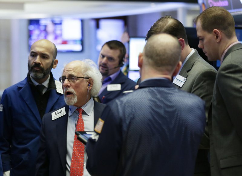 Traders work on the floor at the closing bell at the New York Stock Exchange on Wall Street in New York City on Thursday. The Dow Jones Industrial Average dropped 660.02 points, or 2.8 percent, to 22,686.22 after Apple announced the company had lowered its revenue guidance for the first quarter of 2019. Photo by John Angelillo/UPI