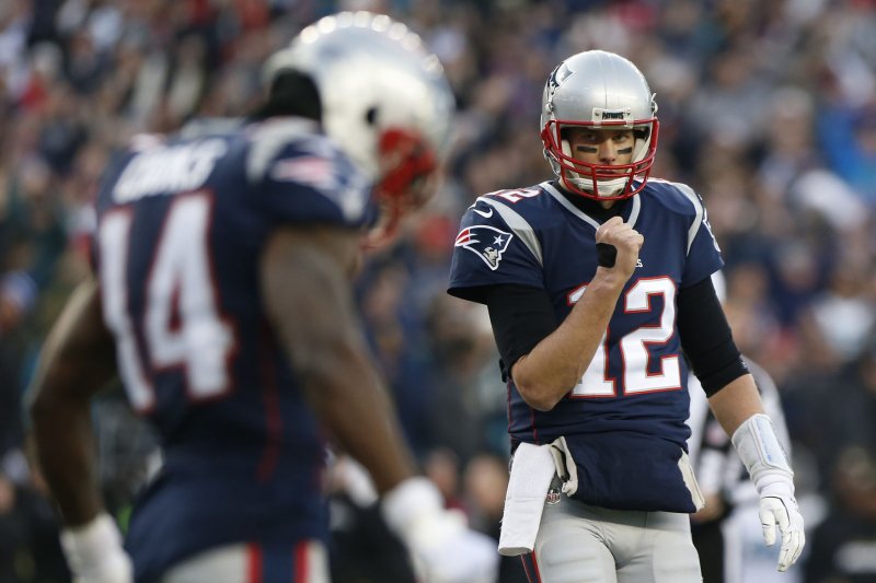 New England Patriots quarterback Tom Brady (12) pumps his fist after the Patriots scored on a short run against the Jacksonville Jaguars during the second quarter of the AFC Championship game at Gillette Stadium in Foxborough, Massachusetts on January 21, 2018. Photo by Matthew Healey/ UPI | <a href="/News_Photos/lp/f3fd26294173764c466def9b106a4216/" target="_blank">License Photo</a>