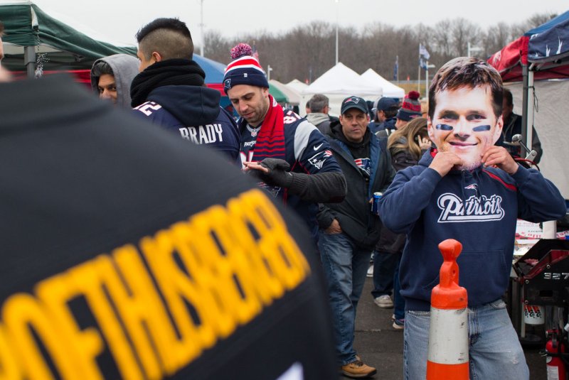 A New England Patriots fan (not the one pictured here wearing the Tom Brady mask) pleaded not guilty on Monday to pulling a fire alarm at the Pittsburgh Steelers' team hotel 15 hours before Sunday night's AFC Championship Game. Photo by Matthew Healey/ UPI | <a href="/News_Photos/lp/ec426a6372061e574b3a73a61527382e/" target="_blank">License Photo</a>