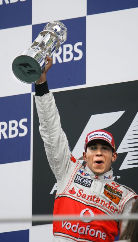 England's Lewis Hamilton raises his first place trophy at the United States Formula One race at the Indianapolis Motor Speedway in Indianapolis on Sunday, June 17, 2007. (UPI PHOTO/ Tom Russo)