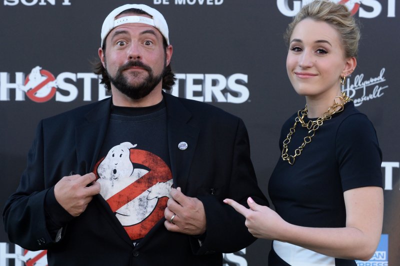 Director Kevin Smith (L), pictured with his daughter Harley Quinn Smith. The filmmaker posted on Twitter that he had suffered a massive heart attack. File Photo by Jim Ruymen/UPI