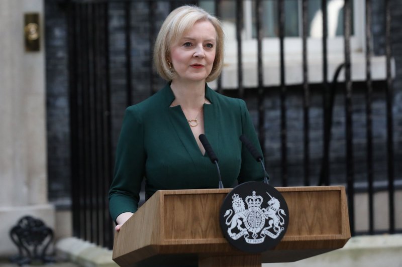 Former British Prime Minister Liz Truss makes a statement prior to her formal resignation outside the door of No. 10 Downing Street on October 25. A report said her phone was hacked by foreign agents while serving as foreign secretary. Photo by Hugo Philpott/UPI