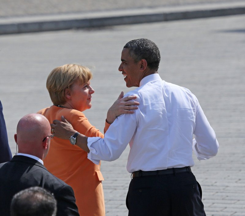 U.S. President Barack Obama (R) and German Chancellor Angela Merkel depart from the Brandenburg Gate in Berlin on June 19, 2013. Obama is in Berlin on his first official state visit to Germany and spoke at the historic site where fifty years earlier U.S. President John F. Kennedy delivered his famous "Ich bin ein Berliner (I am a Berliner)" address . UPI/David Silpa