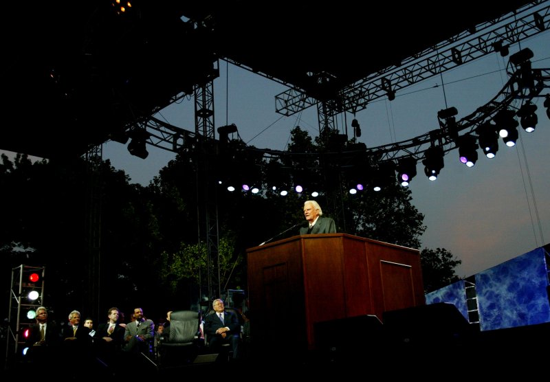 Billy Graham, a world wide symbol of evangelism, preaches to a crowd that exceeds 70,000 during the Greater New York Billy Graham Crusade held at Flushing Meadows Park on June 24, 2005 in New York City.The three-day event was Graham's last crusade as the 86-year-old acknowledged that various illnesses are forcing him to retire. Graham turned 95 Thursday. (UPI Photo/Monika Graff)