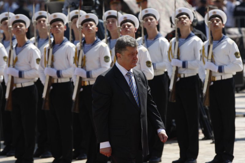 Ukrainian President Petro Poroshenko reviews an honor guard during the inauguration ceremony in Sophia Square in Kiev on June 7, 2014. (UPI/Ivan Vakolenko)
