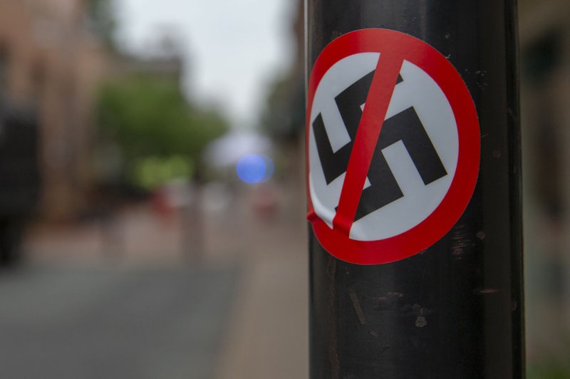 An anti Nazi sticker is seen on a lamppost in downtown Charlottesville, Va., on Saturday ahead of the anniversary of the United The Right rally during which a counter-protester, Heather Hayer was killed. A state of emergency has been declared in Virginia as police in Charlottesville and the surrounding area prepare for Sunday events. Photo by Alex Edelman/UPI