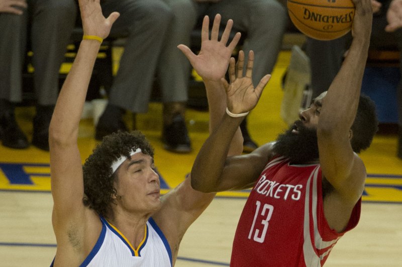 Houston Rockets' James Harden (13) shoots front of Golden State Warriors Anderson Varejao in the fourth period of game 5 of the NBA playoffs at Oracle Arena in Oakland, California on April 27, 2016. The Warriors defeated the Rockets 114-81 to win the first round of playoff 4-1. Photo by Terry Schmitt/UPI | <a href="/News_Photos/lp/dd351d5c6ec54a17dfac9864ad77ce22/" target="_blank">License Photo</a>