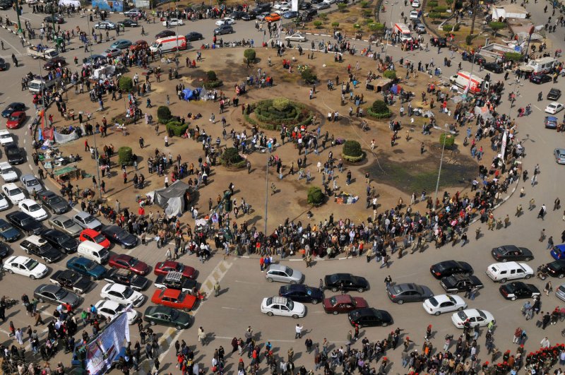 A general view shows crowds and traffic at Cairo's Tahrir Square, the epicentre of the popular revolt that drove Egyptian President Hosni Mubarak from power, as people camping out in the square begin to leave, February 13, 2011. Mubarak left office on Friday after 30 years. UPI | <a href="/News_Photos/lp/b3e0aa93939313bd5dcc471a134abef4/" target="_blank">License Photo</a>