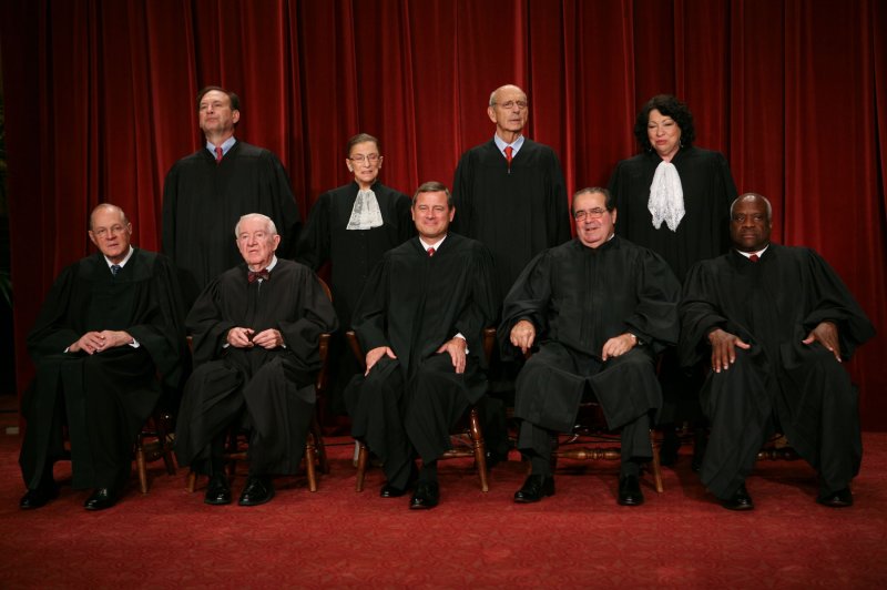 The Supreme Court Justices of the United States posed for their official "family" group photo and then allowed members of the media to take photos afterward on September 29, 2009, at the Supreme Court in Washington. The justices are John G. Roberts (Chief Justice), John Paul Stevens, Antonin Scalia, Anthony Kennedy, Clarence Thomas, Ruth Bader Ginsburg, Stephen Breyer, Samuel Alito, Sonia Sotomayor. UPI/Gary Fabiano/Pool