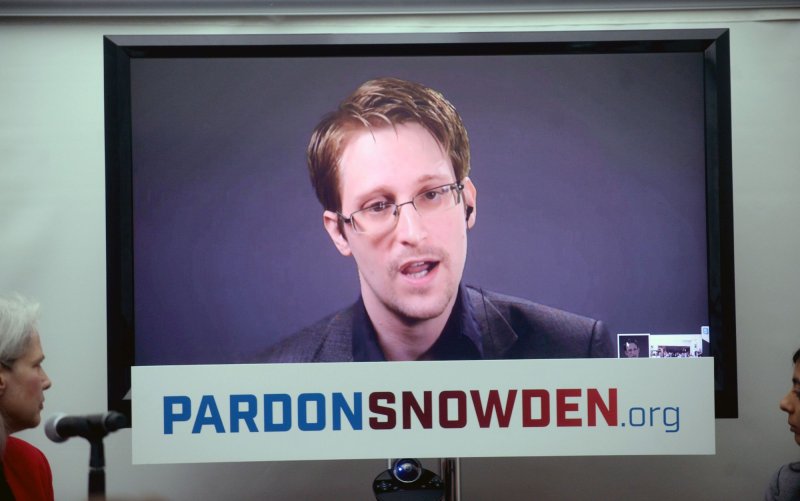 Edward Snowden speaks at a conference via a monitor at the launch of a campaign calling on President Obama to pardon him before he leaves office on September 14 in New York City. The U.S. House Intelligence Committee on Thursday released a redacted version of its full report on the investigation of leaked classified material by former contractor Snowden. The report states that Snowden has had contact with Russian agents in the two years he has lived in Moscow. File Photo by Dennis Van Tine/UPI