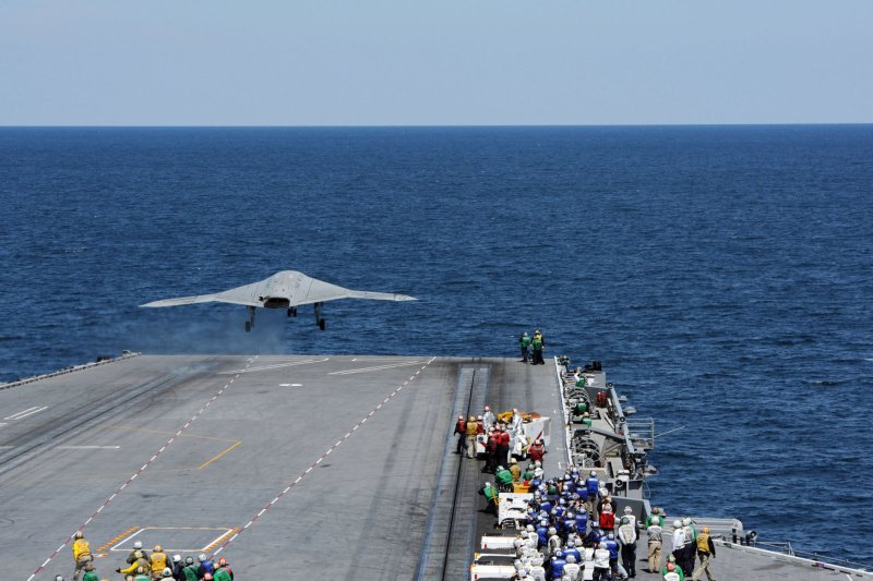 An X-47B Unmanned Combat Air System (UCAS) demonstrator launches Tuesday, May 14, 2013 from the flight deck of the aircraft carrier USS George H.W. Bush (CVN 77). George H.W. Bush is the first aircraft carrier to successfully catapult launch an unmanned aircraft from its flight deck. (UPI/Timothy Walter/US Navy)