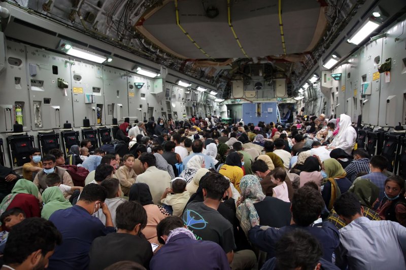 Refugees are evacuated from Hamid Karzai International Airport in Kabul, Afghanistan on&nbsp; August 26 as the U.S. military withdraws from the country after 20 years. File Photo by Hassan Majeed/UPI