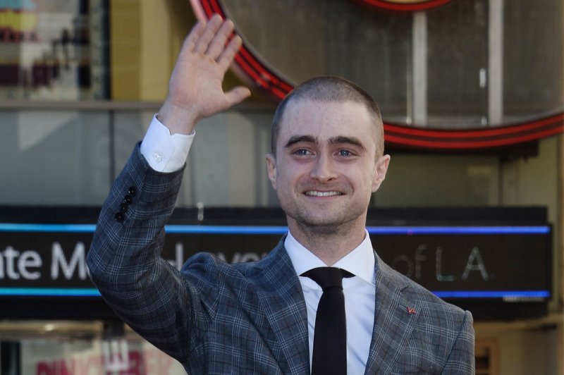Daniel Radcliffe waves during an unveiling ceremony honoring him with the 2,565th star on the Hollywood Walk of Fame in Los Angeles on November 12, 2015. Radcliffe recently said that he wouldn't ever rule out returning to his iconic Harry Potter role. File Photo by Jim Ruymen/UPI | <a href="/News_Photos/lp/8b7ad91183e55cc0064001fdf9875579/" target="_blank">License Photo</a>