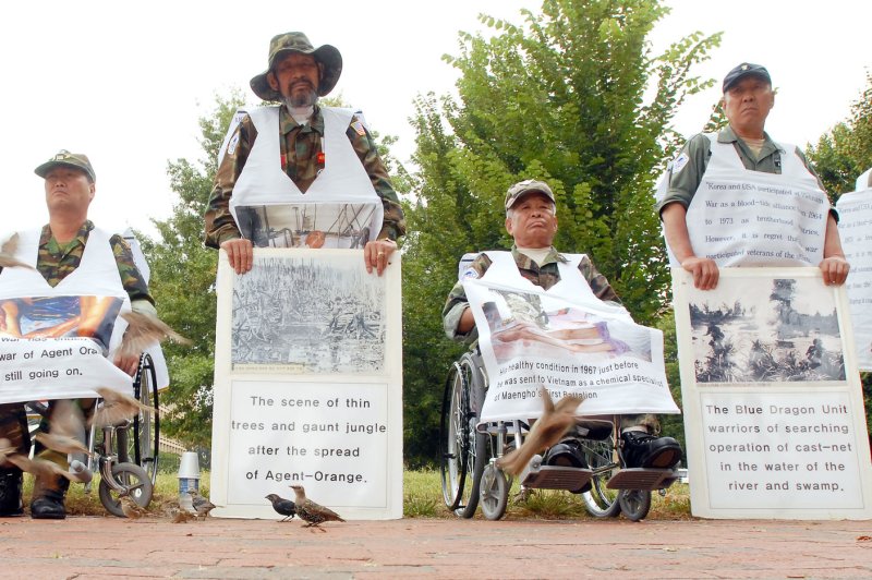 Members of the Korean Disabled Veteran's Association for Agent Orange hold a vigil near the White House in Aug. 2006. The delegation of South Korean war veterans who are say they are victims of Agent Orange, sought compensation for their injuries from the U.S. government and chemical companies. File Photo by Roger L. Wollenberg/UPI