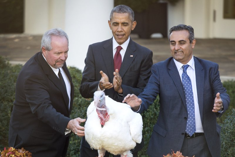 President Barack Obama pardons the National Thanksgiving Turkey during the 68th annual ceremony in the Rose Garden at the White House in Washington, D.C. on Wednesday. Obama pardoned two turkeys, Abe and Honest, during the annual Thanksgiving tradition. Obama was joined by National Turkey Federation Chairman Jihad Douglas (C) and Joe Hedden of foster farms. Photo by Kevin Dietsch/UPI