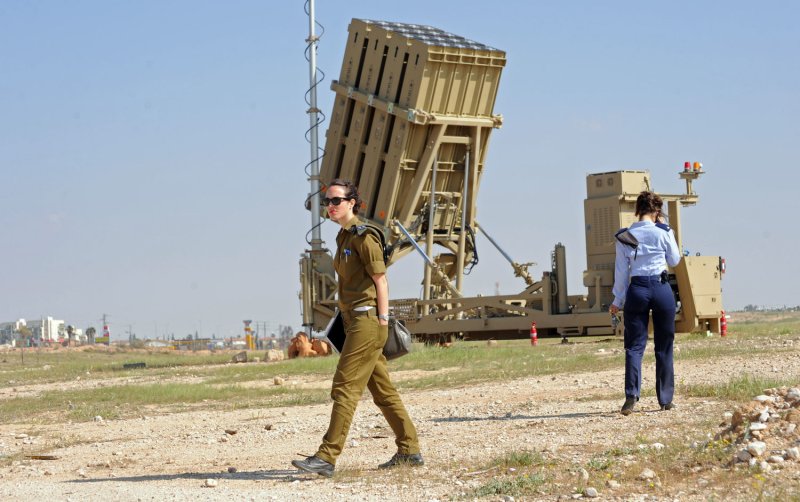 Israeli soldiers stand near the Iron Dome, a new anti-rocket system, stationed near the southern city of Beersheba, Israel, March 27, 2011. The Israeli Defense Force deployed the $200 million Iron Dome system in response to dozens of rockets fired by Palestinian militants from Gaza in the past weeks. The Iron Dome is meant to protect Israeli towns from rockets fired from Gaza. UPI/Debbie Hill