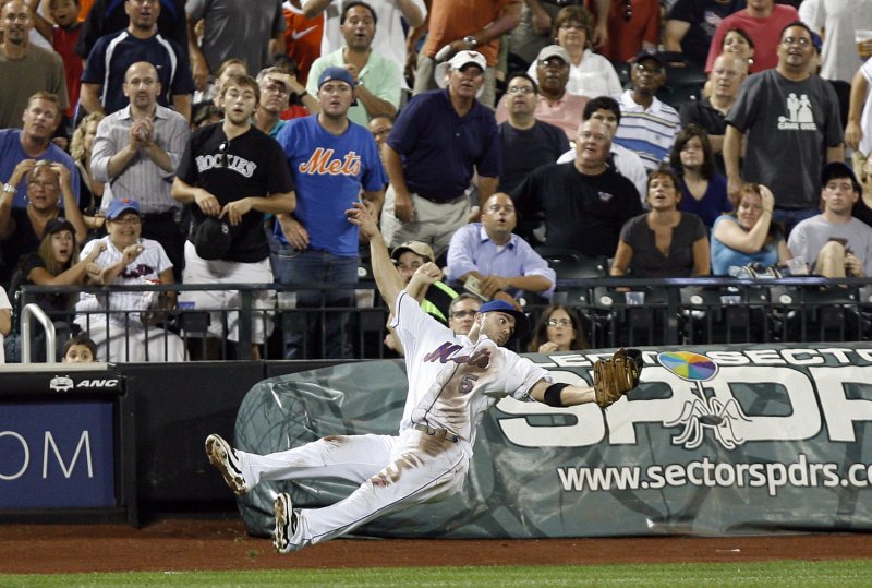 New York Mets David Wright makes a tough catch on a ball hit by Colorado Rockies Seth Smith in the fifth inning at Citi Field in New York City on July 28, 2009. (UPI Photo/John Angelillo)