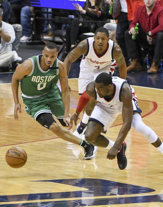 Avery Bradley of the Boston Celtics battles for a loose ball in a game against the Washington Wizards. Bradley has been traded to the Detroit Pistons. Photo by Mark Goldman/UPI | <a href="/News_Photos/lp/015429062c4fcbbd5b4c7799fbfdaaf8/" target="_blank">License Photo</a>
