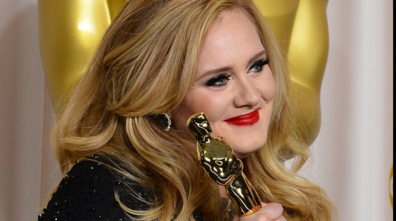 Singer Adele Adkins hold her Oscar for best Achievement in Music Written for Motion Pictures (Original Song) - " Skyfall" backstage at the 85th Academy Awards at the Hollywood and Highland Center in the Hollywood section of Los Angeles on February 24, 2013. UPI/Jim Ruymen | <a href="/News_Photos/lp/61a6f27489bcaf2e721f23cdf95fb9f3/" target="_blank">License Photo</a>