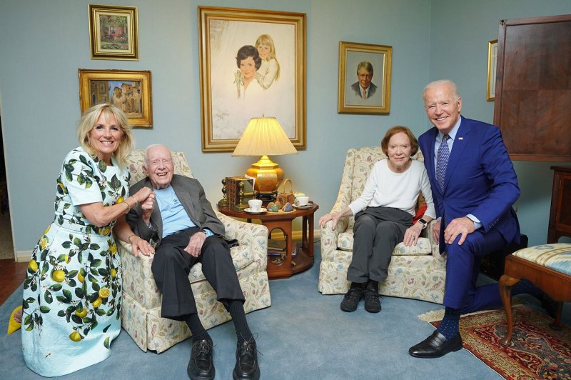 President Joe Biden and first lady Jill Biden are pictured during an April 29, 2021, visit with former President Jimmy Carter and former first lady Rosalynn Carter at their home in Plains, Ga. Carter celebrated his 98th birthday on Saturday. File Photo by Adam Schultz/UPI/Pool | <a href="/News_Photos/lp/0af4c4ff55a5dd3c524550bdaf8df638/" target="_blank">License Photo</a>