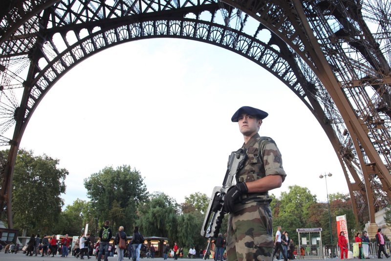 A French army police officer patrols the Eiffel Tower in Paris. File Photo by David Silpa/UPI | <a href="/News_Photos/lp/81970f5c2e4c4d5cc86c63856780c39a/" target="_blank">License Photo</a>