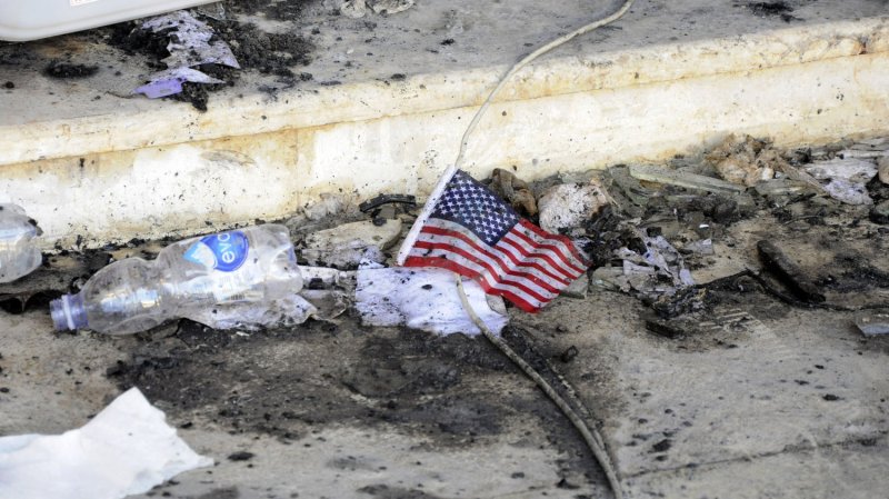 A small American flag is seen in the rubble at the United States consulate, one day after armed men stormed the compound and killed the U.S. Ambassador Christopher Stevens and three others in Benghazi, Libya on September 12, 2012. The gunman were protesting a little known film by an American amateur filmmaker that angered Muslims as it was deemed insulting to the Prophet Mohammad. UPI/Tariq AL-hun