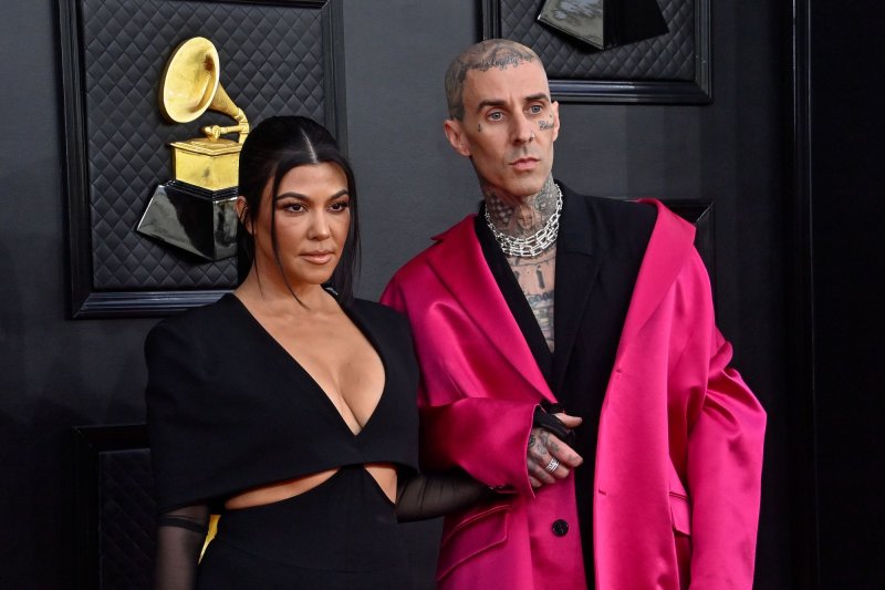 Travis Barker (R), pictured with Kourtney Kardashian, and Blink-182 released the songs "One More Time" and "More Than You Know." File Photo by Jim Ruymen/UPI