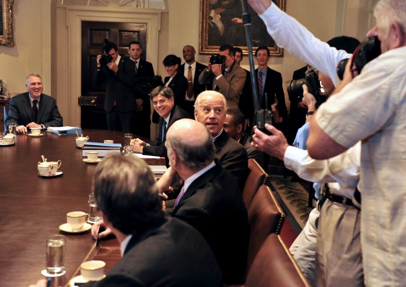 United States Vice President Joe Biden looks back at the photographers after U.S. President Barack Obama (not pictured) kidded him that the Vice President never gets photographed because he sits at the opposite side of the table during a photo-op with bipartisan Congressional Leadership in the Cabinet Room of the White House in Washington, D.C. prior to a meeting to discuss the ongoing efforts to find a balanced approach to deficit reduction. UPI/Ron Sachs/Pool