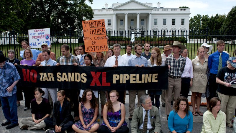 Members of the activist group Sojourners protest the Keystone Tar Sans Pipeline in front of the White House in Washington on August 23, 2011. UPI/Kevin Dietsch