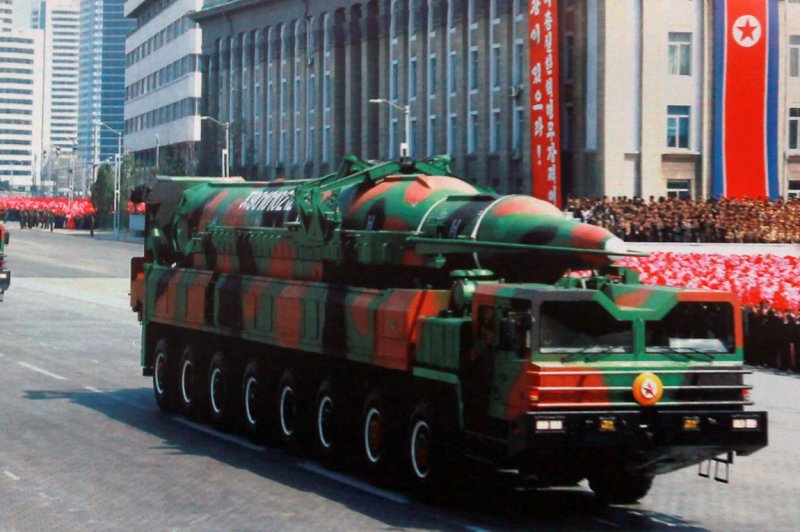 A photo of a mobile, long-range missile launcher is displayed on a picture board in front of the North Korean embassy in Beijing on March 22, 2013. North Korea fired two short-range ballistic missiles into the Sea of Japan on March 1, 2015, as the United States and South Korea began annual military training drills that Pyongyang has long denounced. File photo by Stephen Shaver/UPI