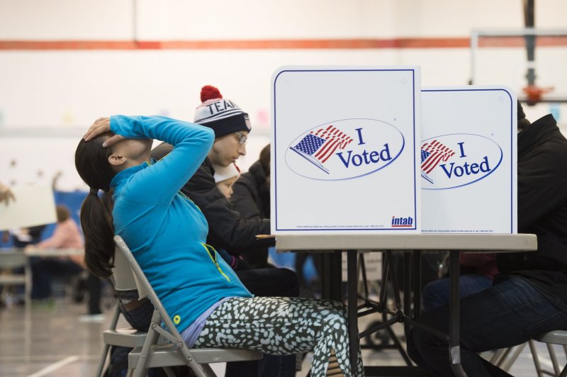 Voters fill out their ballots at Mt. Vernon Center in Alexandria, Va., November 8, 2016. After the 2016 election, more Americans identify as independent, according to a Gallup poll. File Photo by Molly Riley/UPI