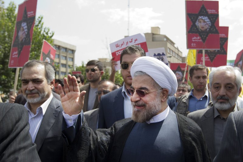 Iran's newly elected president Hassan Rouhani (C) attends a Jerusalem Day (al-Quds Day) rally on August 2, 2013 in Tehran, Iran. Islamic states mark the annual even on the last Friday of the holy month of Ramadan. UPI/Maryam Rahmanian