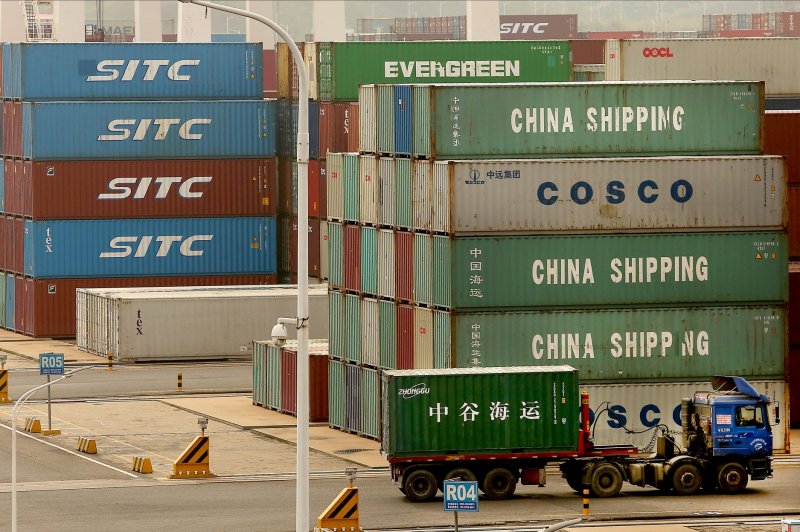 Trucks deliver offloaded containers to designated areas at the Qingdao New Qianwan Automatic Container Terminal in Qingdao, Shandong Province, China on October 14. File Photo by Stephen Shaver/UPI | <a href="/News_Photos/lp/67dfb67ee531cd5b1b826977ca9e0267/" target="_blank">License Photo</a>